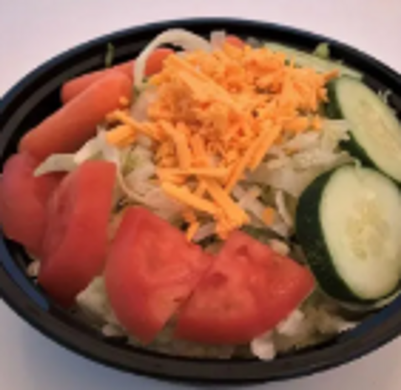 Crisp lettuce, carrots, tomatoes, cucumbers, & cheese